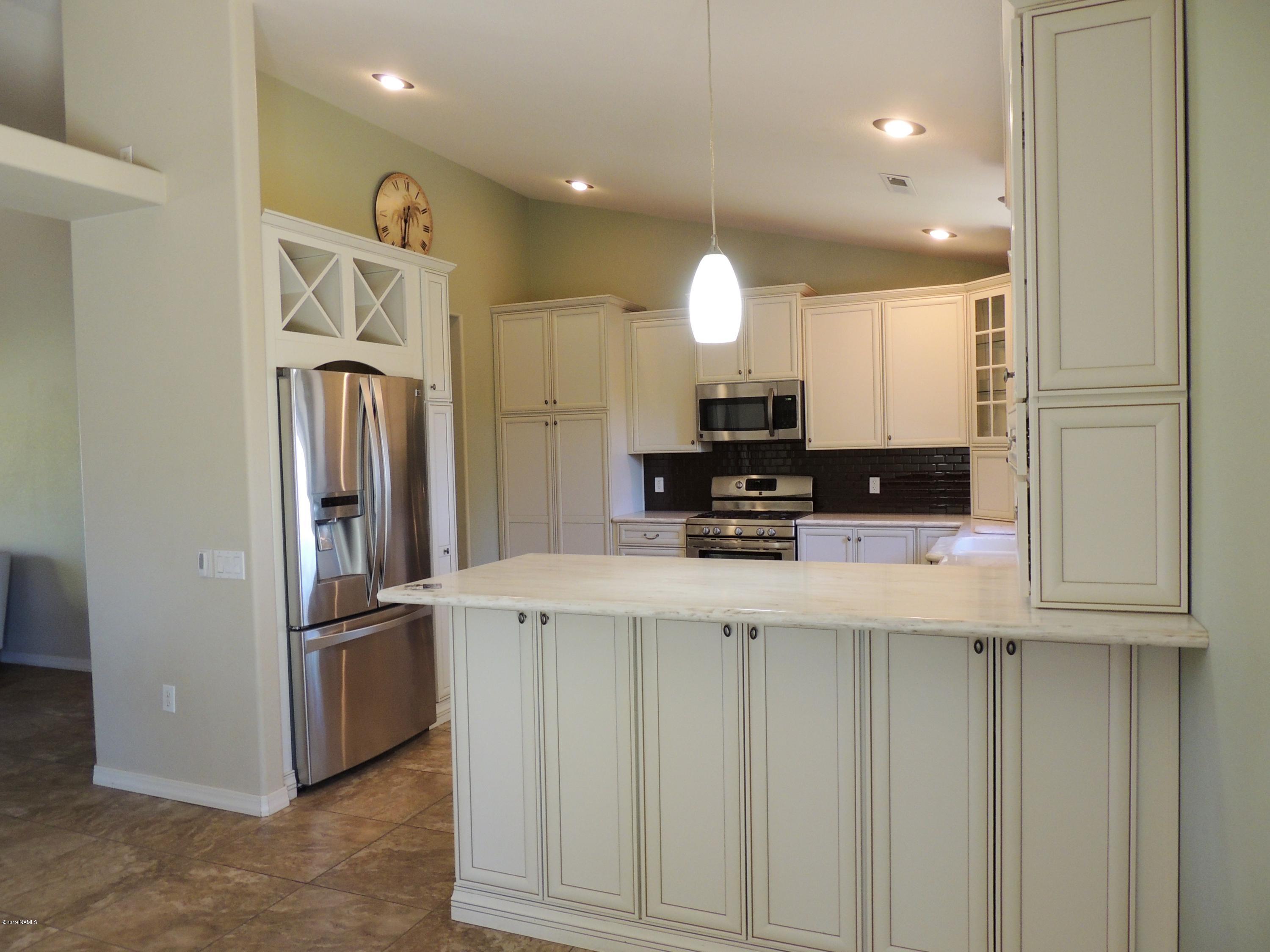 7990 Fawn Run Road Flagstaff, AZ 86004 - Photo 13 of 40 Wine Rack Above Refrigerator