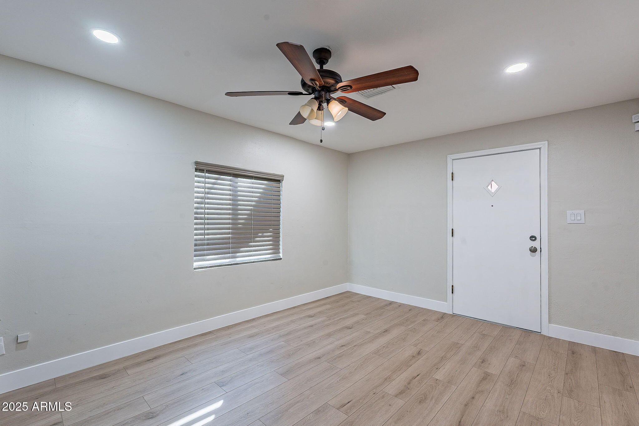 745 East Pierce Street Phoenix, AZ 85006 - Photo 16 of 39 wooden floor in an empty room with a window