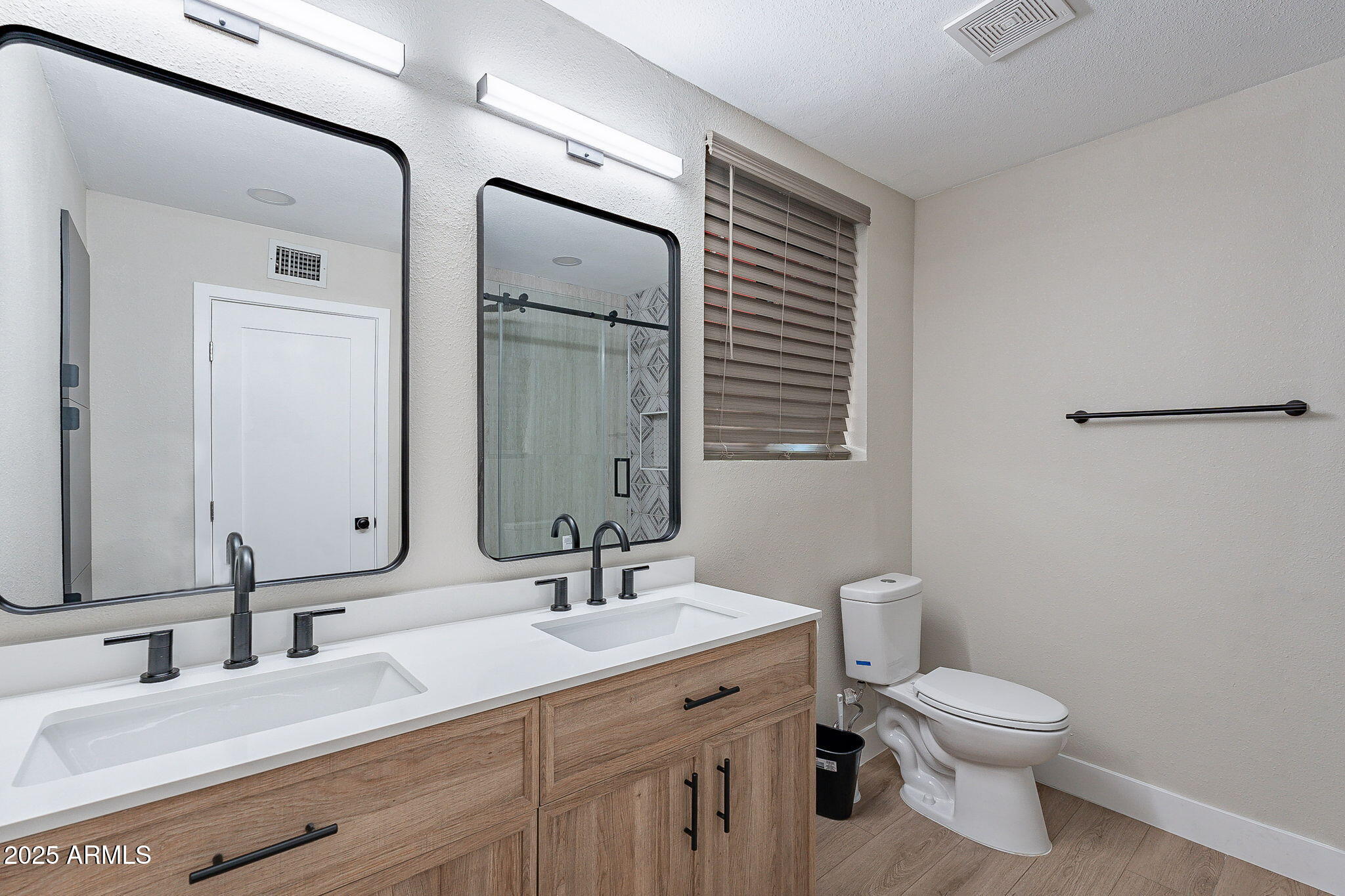 745 East Pierce Street Phoenix, AZ 85006 - Photo 24 of 39 a bathroom with a toilet a sink and mirror