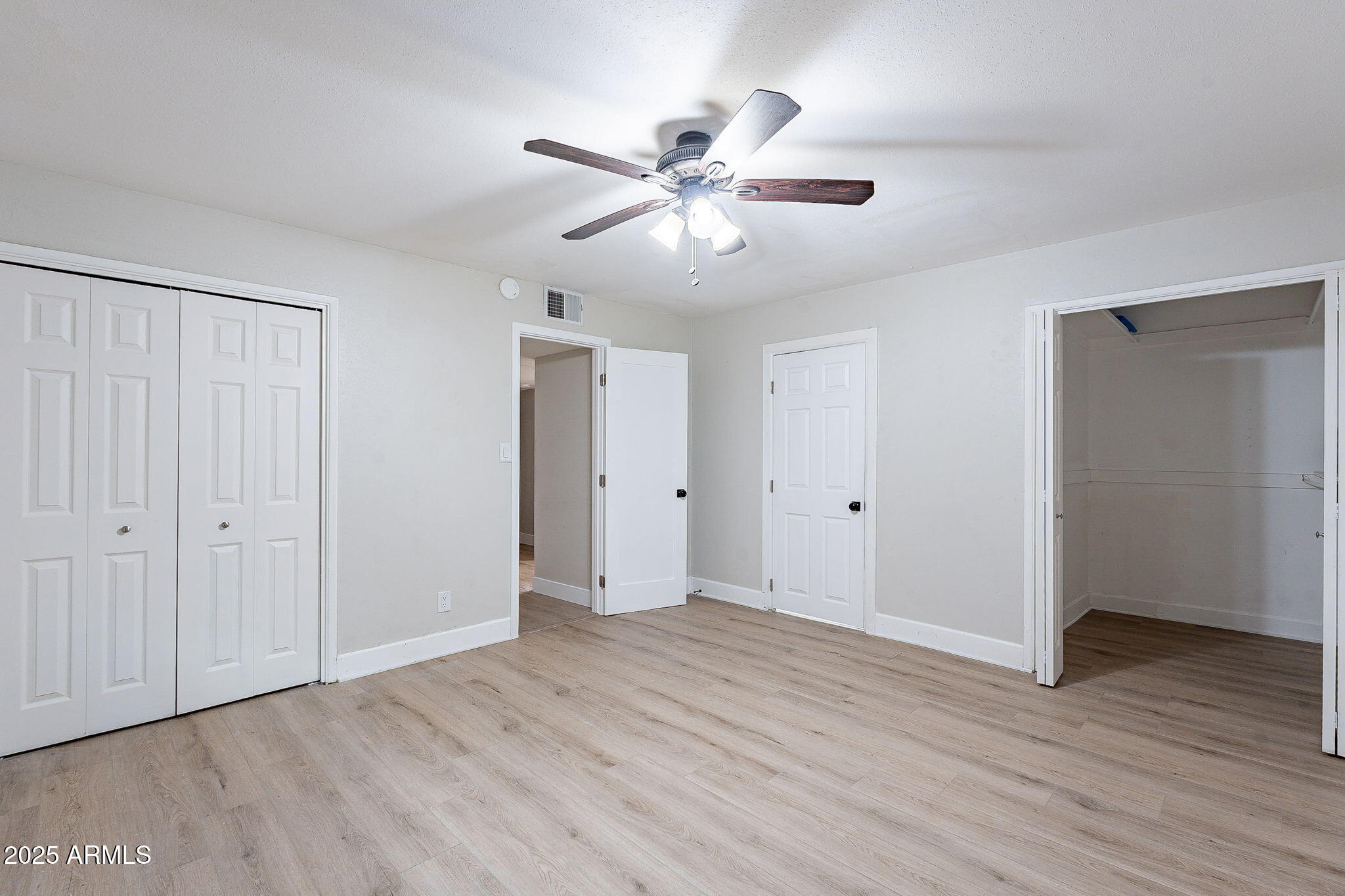 745 East Pierce Street Phoenix, AZ 85006 - Photo 28 of 39 a view of an empty room with wooden floor