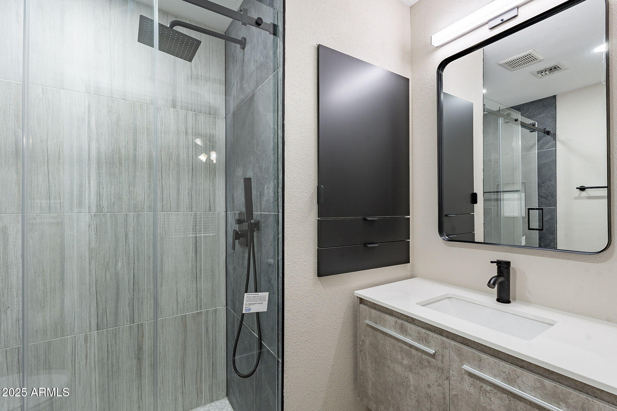 745 East Pierce Street Phoenix, AZ 85006 - Photo 30 of 39 a bathroom with a granite countertop sink and a mirror