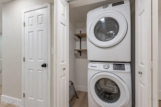a view of a livingroom with furniture and a fan