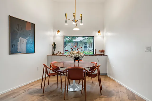 a spacious bathroom with a double vanity sink mirror and bathtub