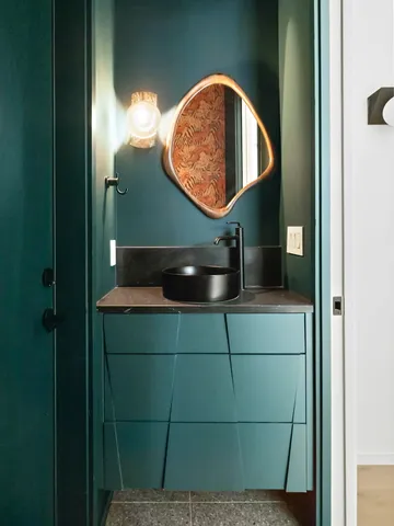 a bathroom with a sink and a mirror