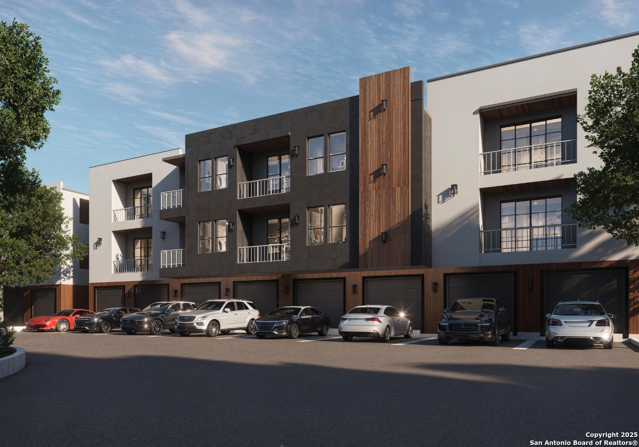 5135 Wurzbach Road, Unit 601 San Antonio, TX 78238 - Photo 3 of 14 a city street lined with buildings and cars parked in front of it