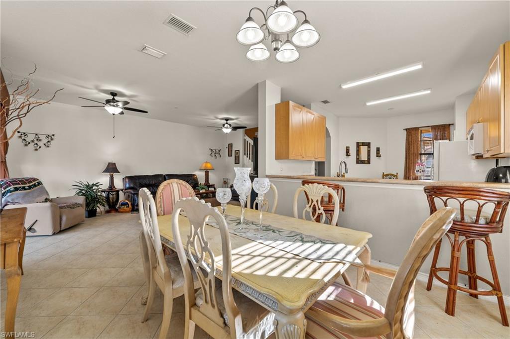 7357 Bristol Circle Naples, FL 34120 - Photo 11 of 44 a view of a dining room with furniture