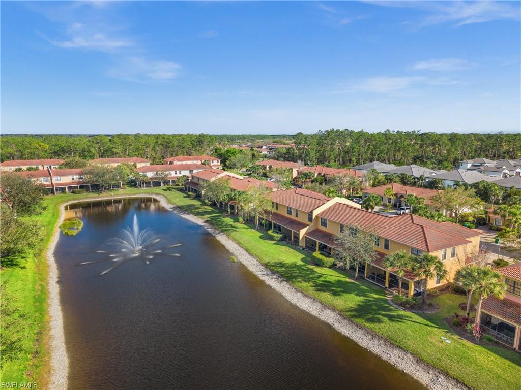 7357 Bristol Circle Naples, FL 34120 - Photo 28 of 44 a view of a lake with a city