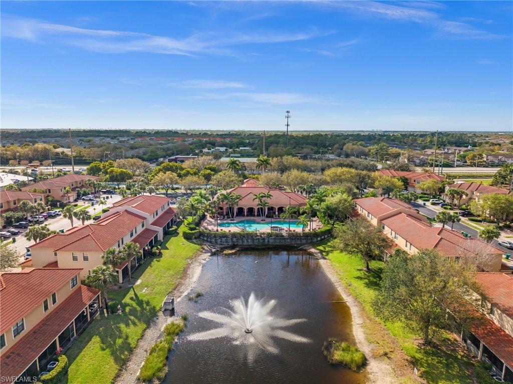 7357 Bristol Circle Naples, FL 34120 - Photo 32 of 44 an aerial view of a city with lots of residential buildings ocean and mountain view in back