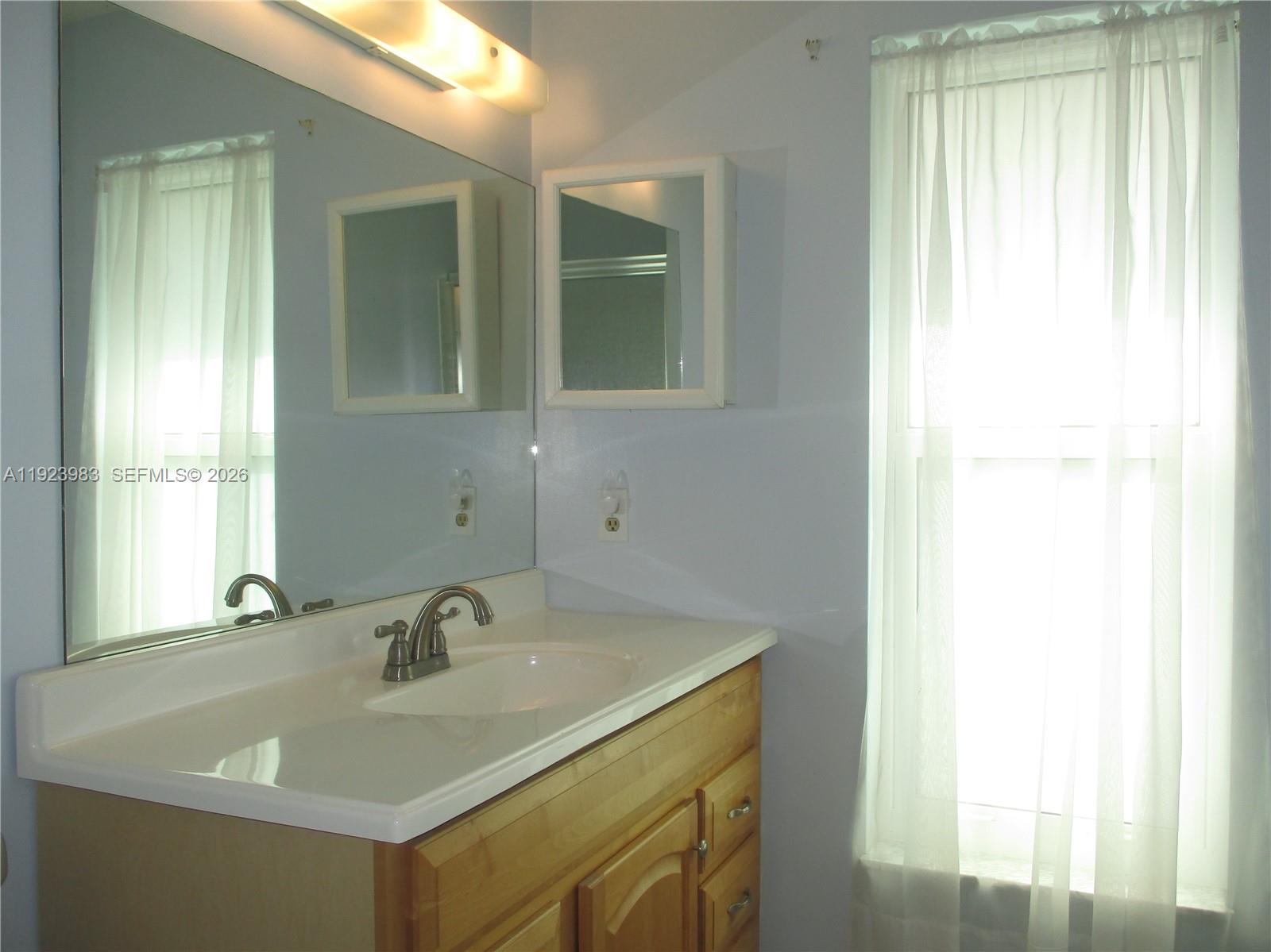 6531 Southeast Federal Highway, Unit D 112 Stuart, FL 34997 - Photo 13 of 33 MASTER BATHROOM WITH A WINDOW FOR EXTRA LIGHT