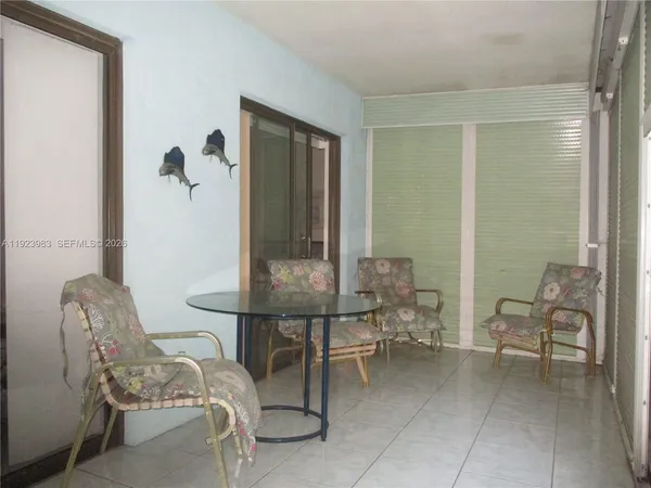 a room with a table and chairs