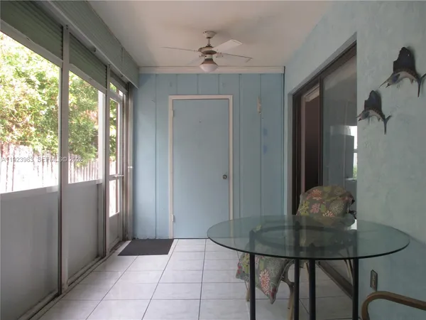 a view of a livingroom with furniture and a window