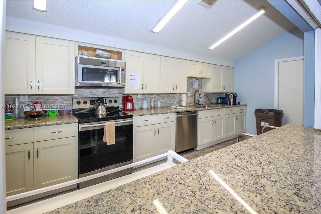 6531 Southeast Federal Highway, Unit D 112 Stuart, FL 34997 - Photo 26 of 33 COMMUNITY ROOM WITH A FULL KITCHEN FOR EVENTS