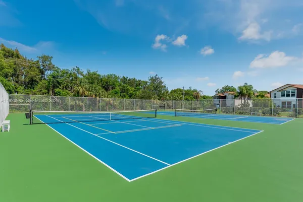 a view of an outdoor space and tennis court