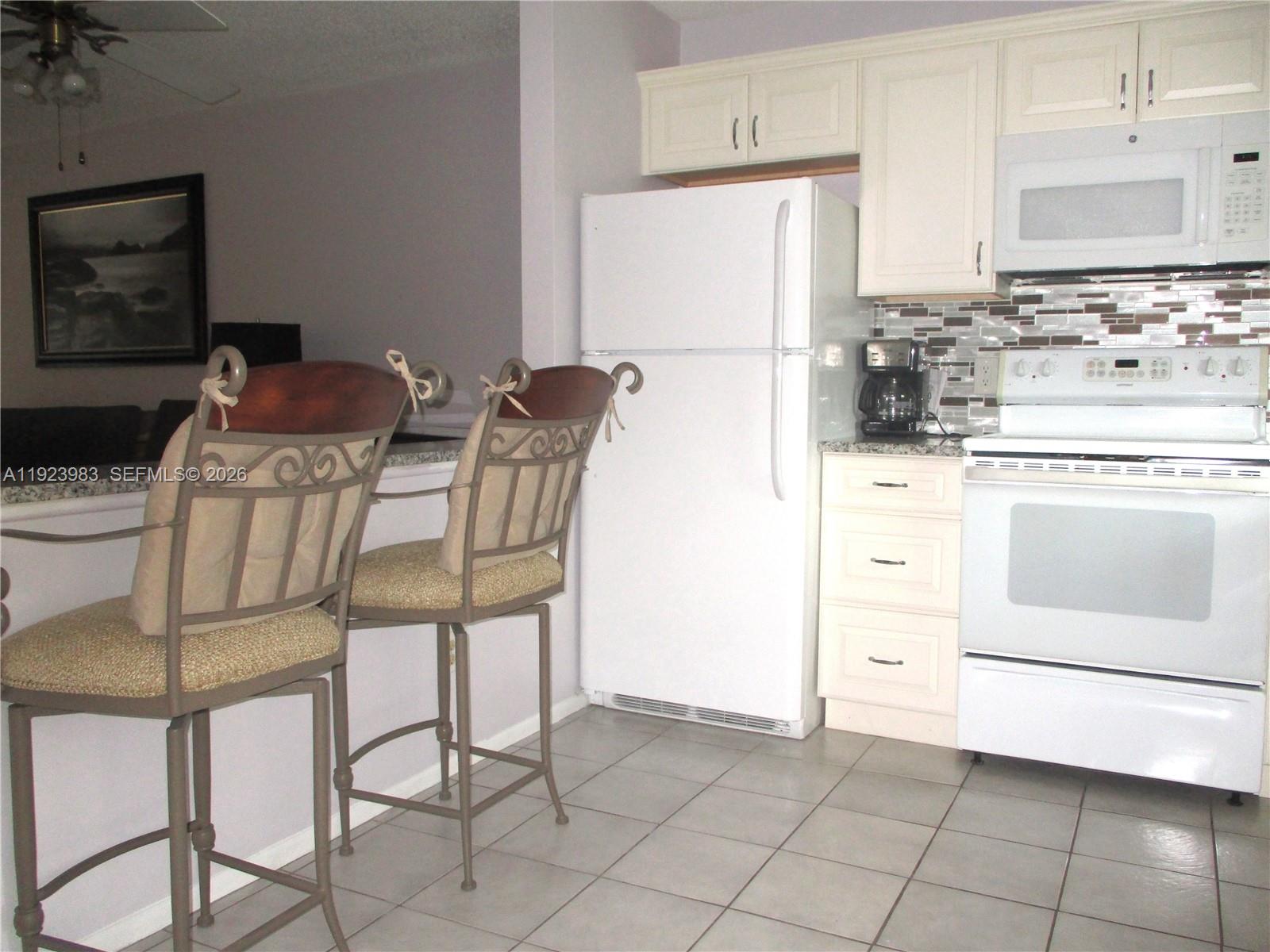 6531 Southeast Federal Highway, Unit D 112 Stuart, FL 34997 - Photo 6 of 33 TWO STOOLS FOR YOUR MORNING COFFEE