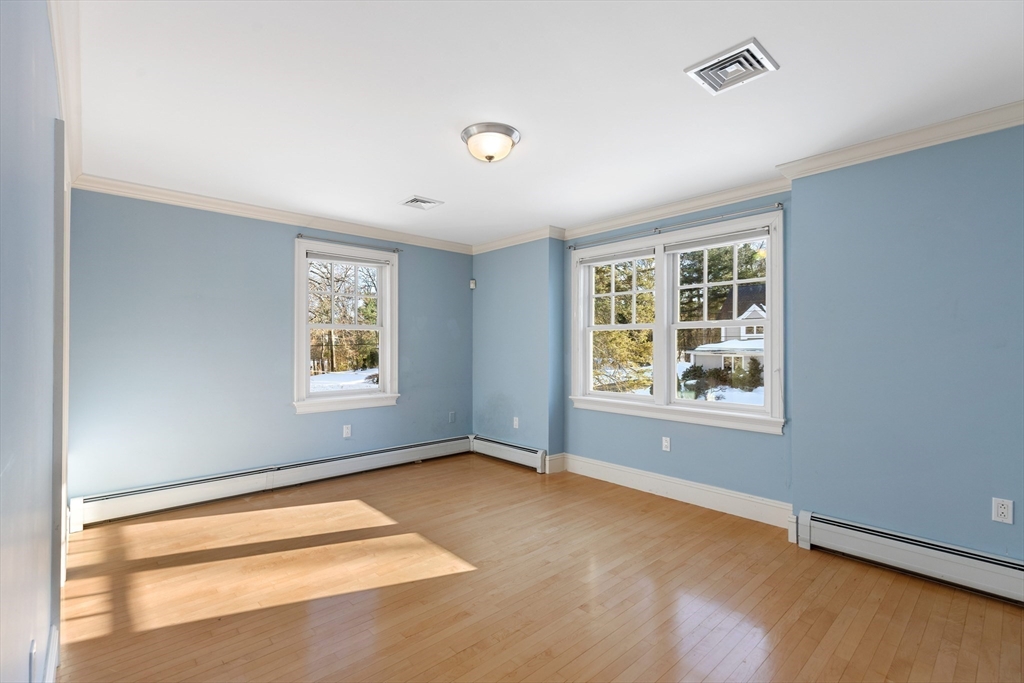 22 Fairbanks Road Lexington, MA 02421 - Photo 33 of 41 a view of room with window and wooden floor