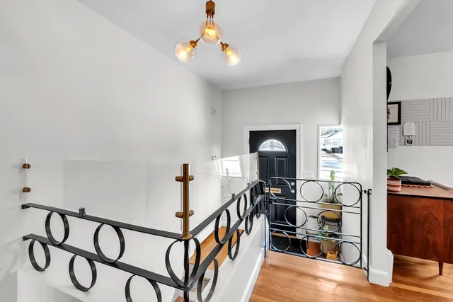 a view of an entryway with wooden floor