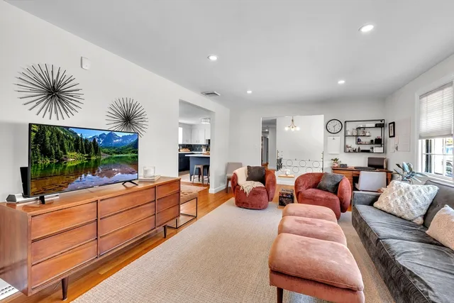 a living room with furniture fireplace and flat screen tv