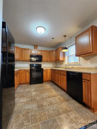 a kitchen with stainless steel appliances and a sink