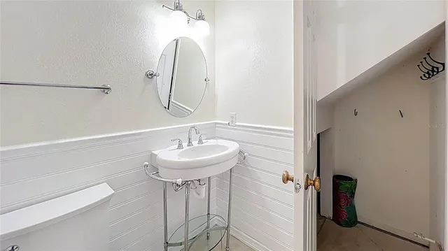 a view of a kitchen with wooden floor and entryway