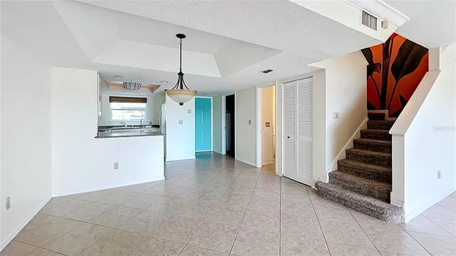 a kitchen with a stove a sink and a refrigerator
