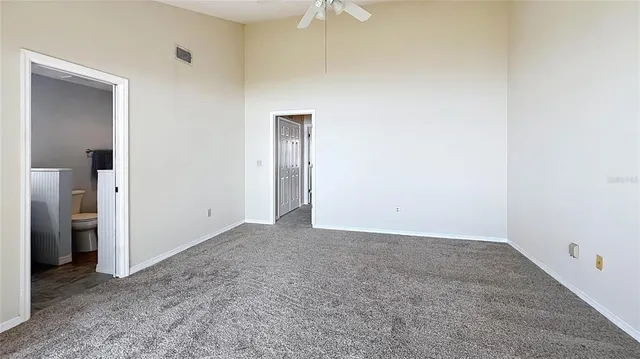a bathroom with a toilet a sink and shower