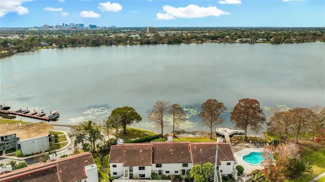 an aerial view of ocean and residential houses