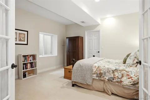 a bedroom with a bed and closet