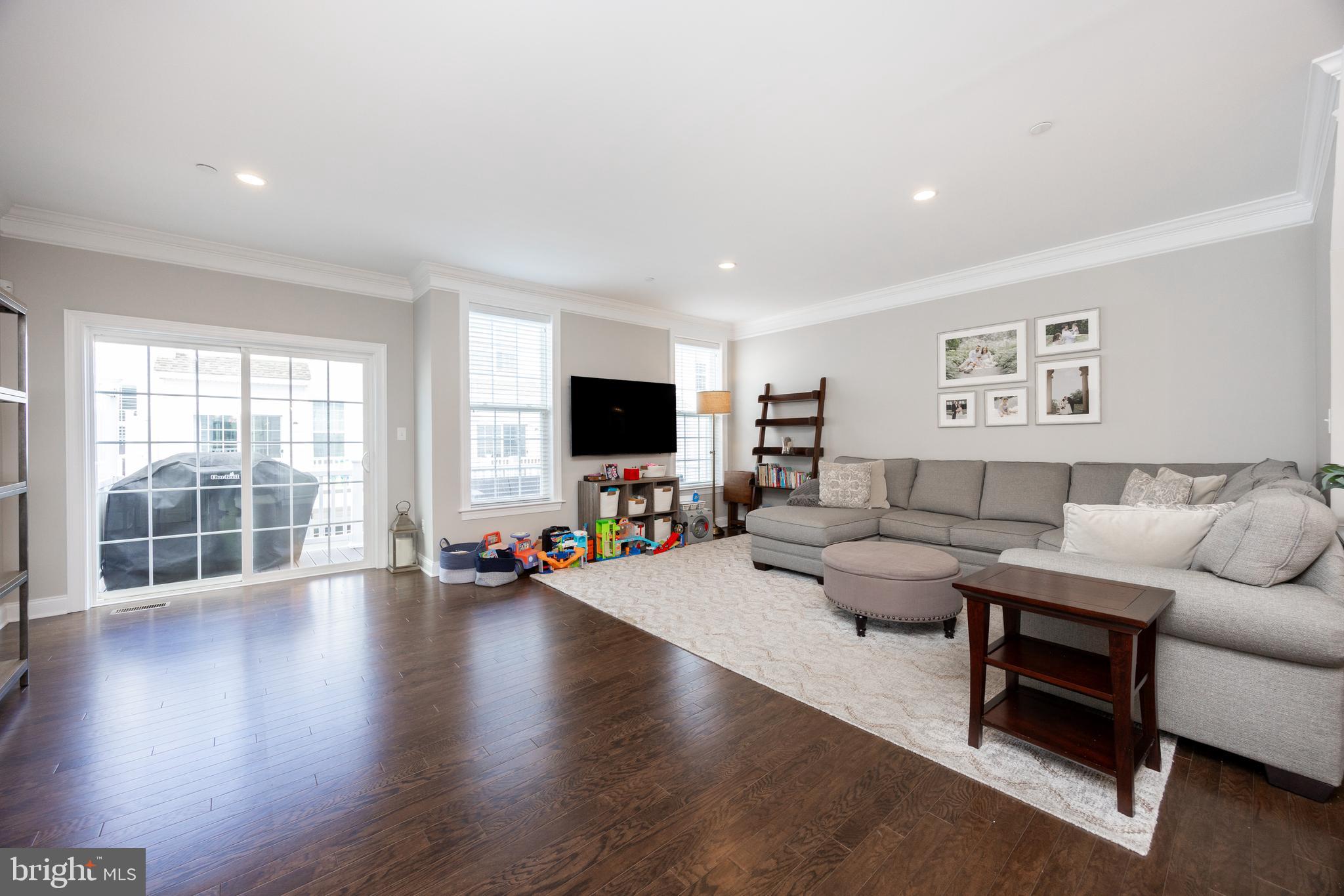 205 Murray Lane Springfield, PA 19064 - Photo 11 of 37 a living room with furniture and a flat screen tv
