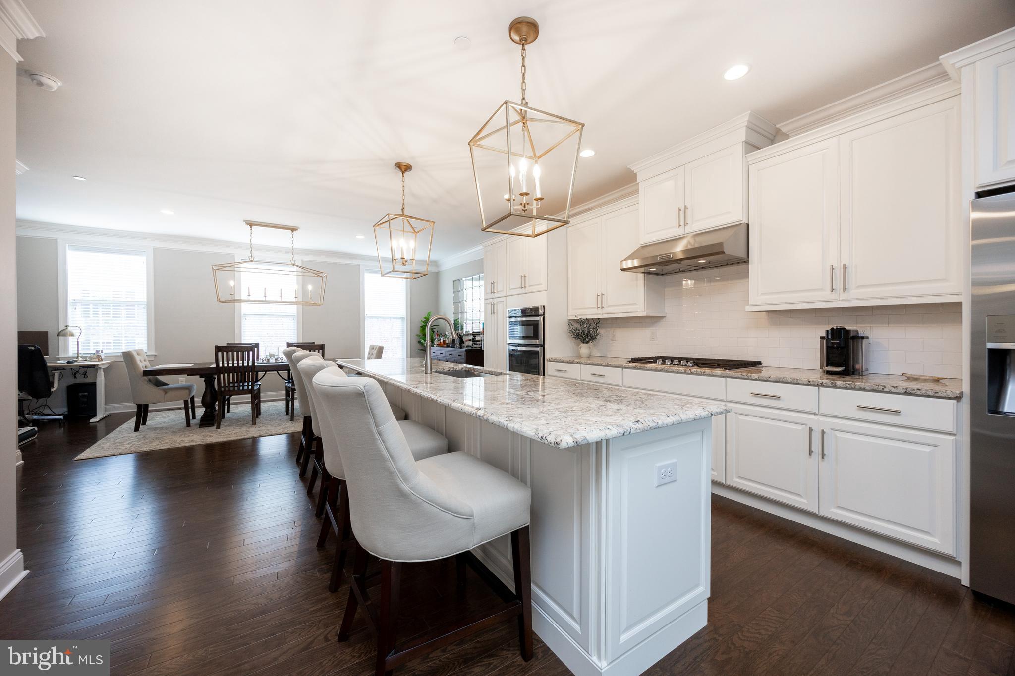 205 Murray Lane Springfield, PA 19064 - Photo 12 of 37 a kitchen with granite countertop white cabinets and stainless steel appliances
