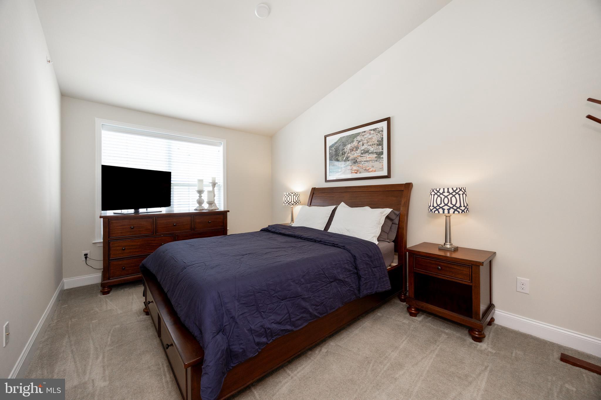 205 Murray Lane Springfield, PA 19064 - Photo 18 of 37 a bedroom with a bed and a flat screen tv