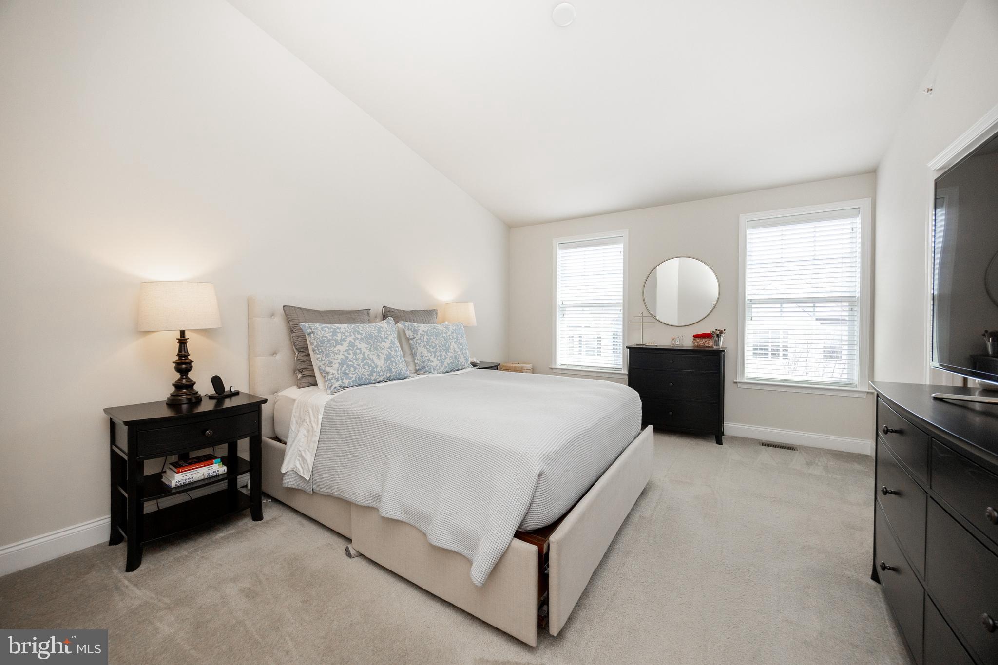 205 Murray Lane Springfield, PA 19064 - Photo 23 of 37 a spacious bedroom with a bed and dresser