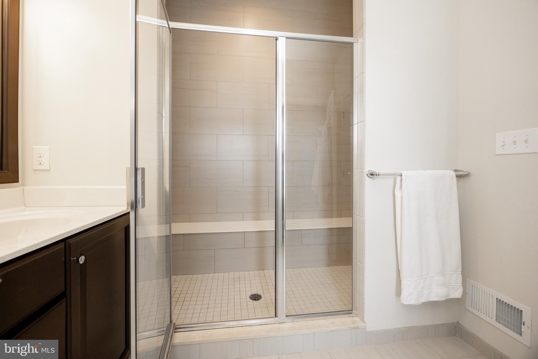 205 Murray Lane Springfield, PA 19064 - Photo 24 of 37 a bathroom with a glass shower door