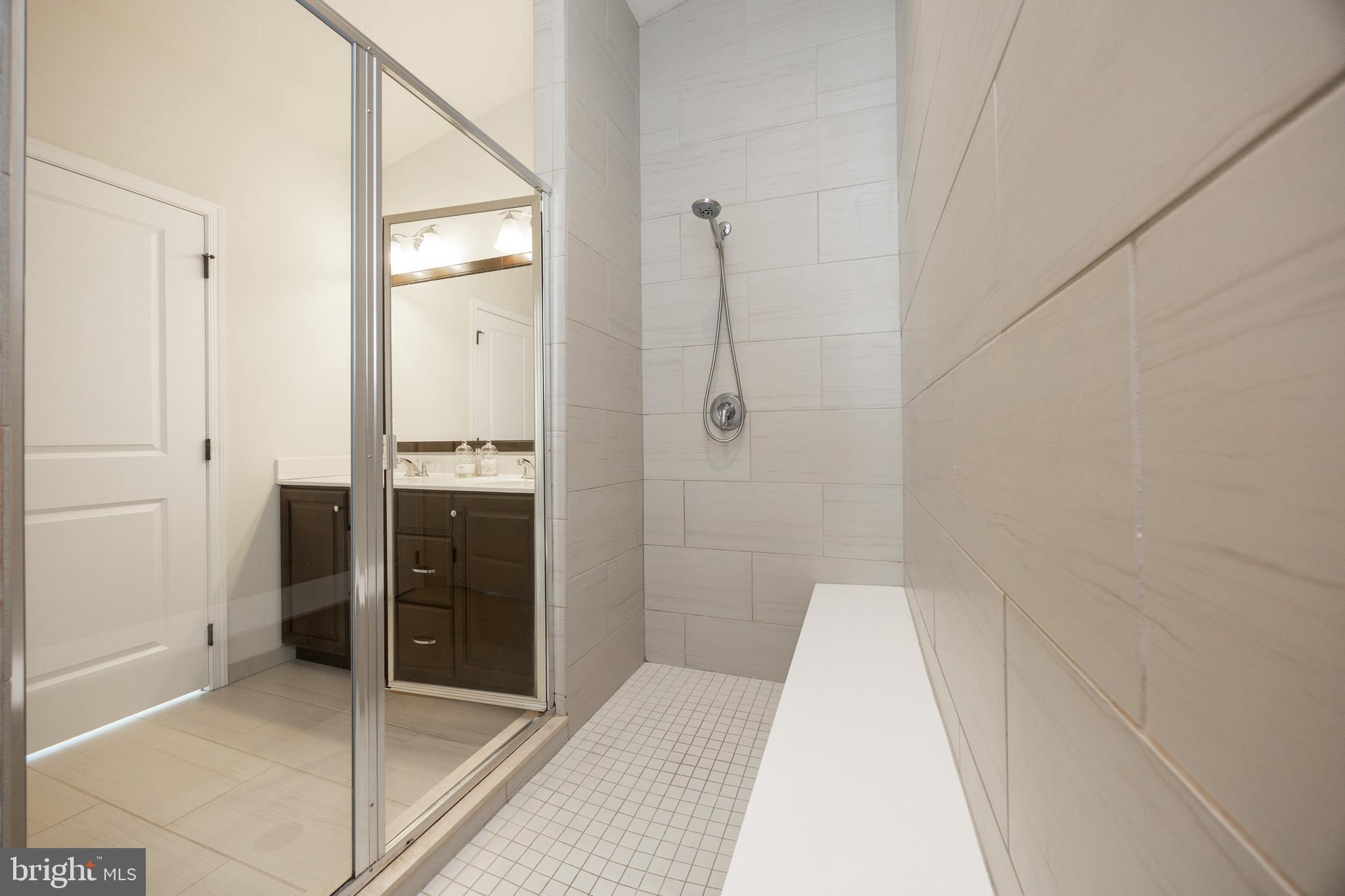 205 Murray Lane Springfield, PA 19064 - Photo 25 of 37 a bathroom with a bathtub and a shower