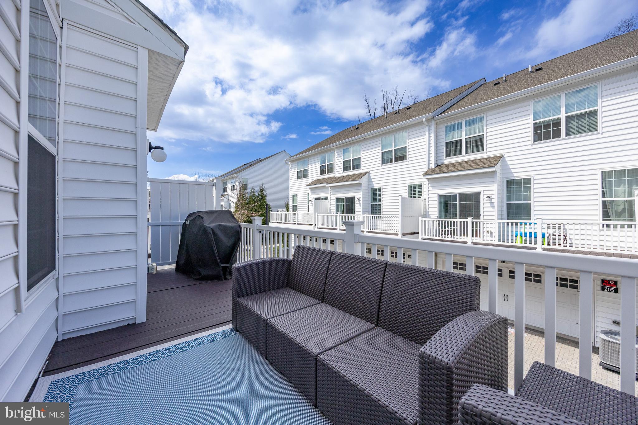 205 Murray Lane Springfield, PA 19064 - Photo 37 of 37 a balcony with furniture and a table