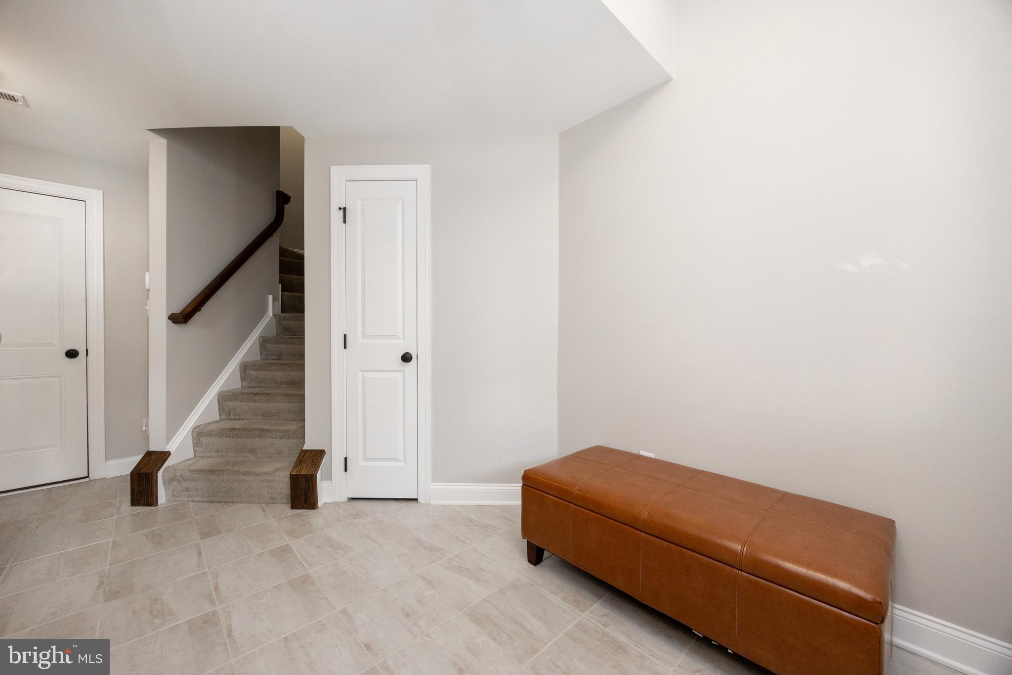 205 Murray Lane Springfield, PA 19064 - Photo 5 of 37 a room with a couch and stairs