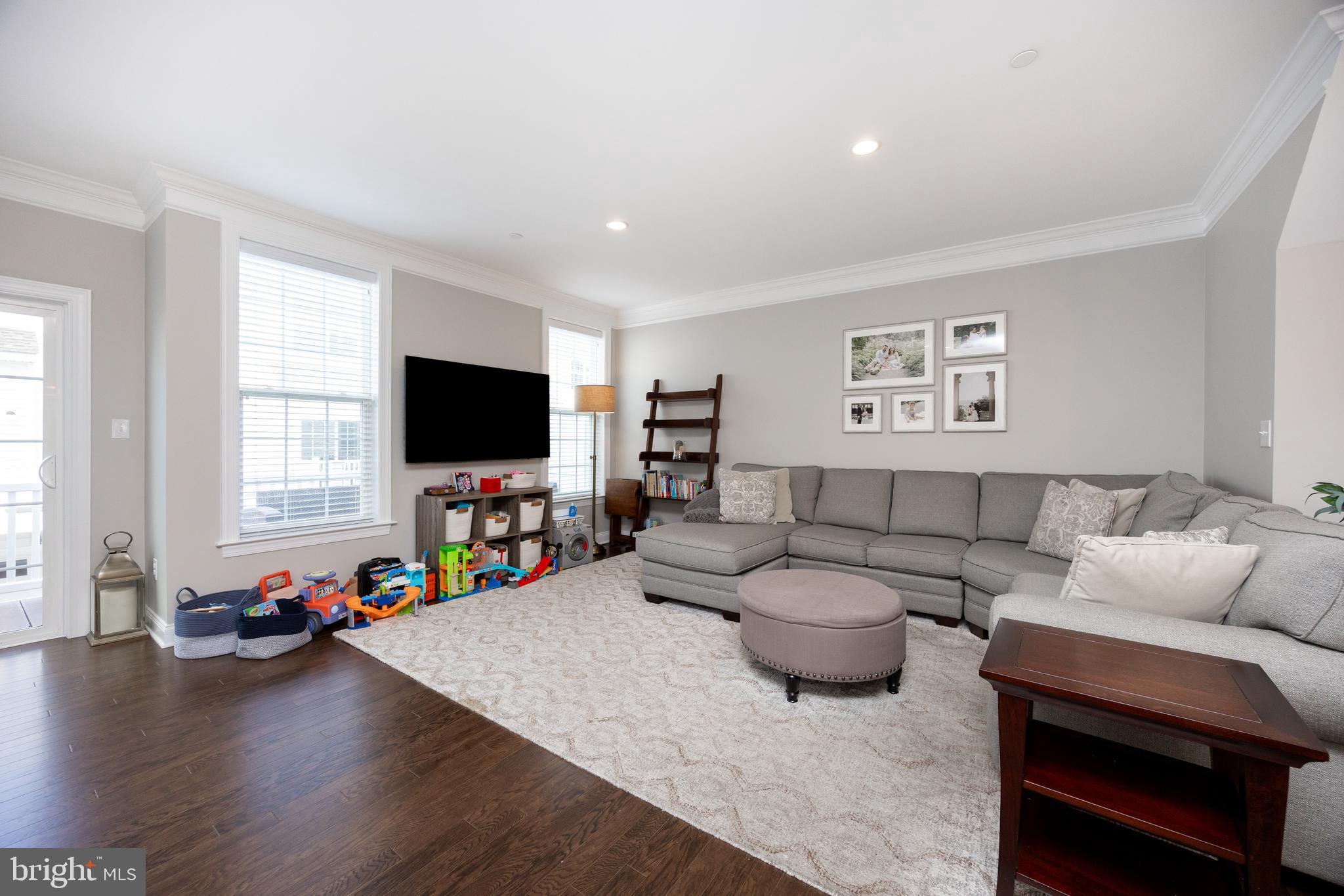 205 Murray Lane Springfield, PA 19064 - Photo 10 of 37 a living room with furniture and a flat screen tv