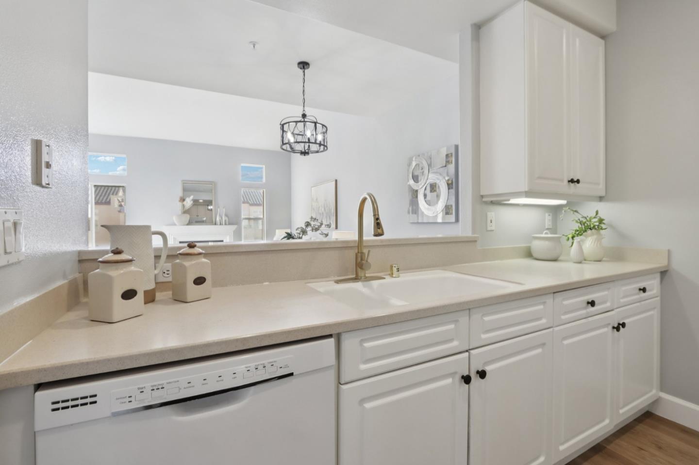 1951 O'Farrell Street, Unit 404 San Mateo, CA 94403 - Photo 11 of 28 a bathroom with a sink and a mirror