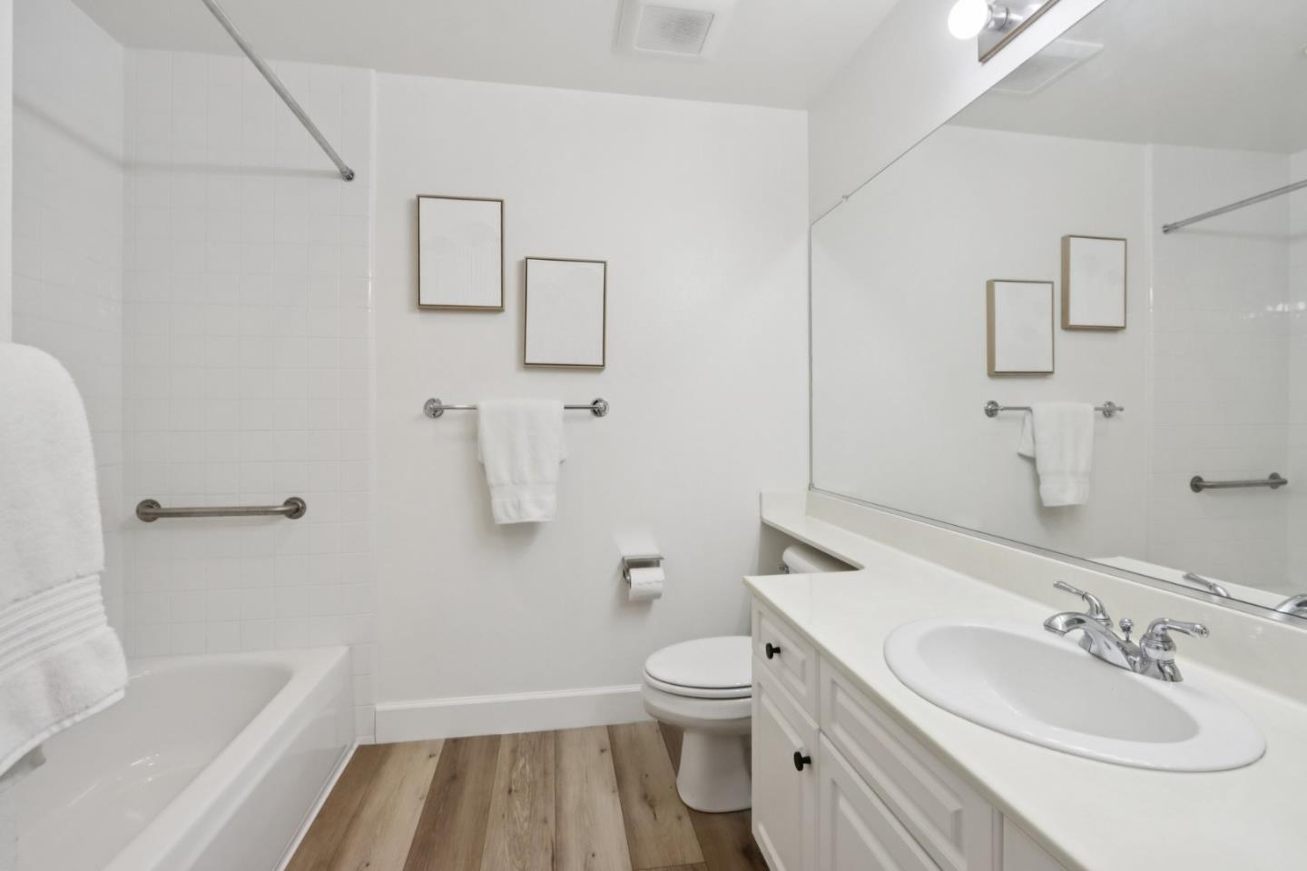 1951 O'Farrell Street, Unit 404 San Mateo, CA 94403 - Photo 12 of 28 a bathroom with a sink toilet and shower