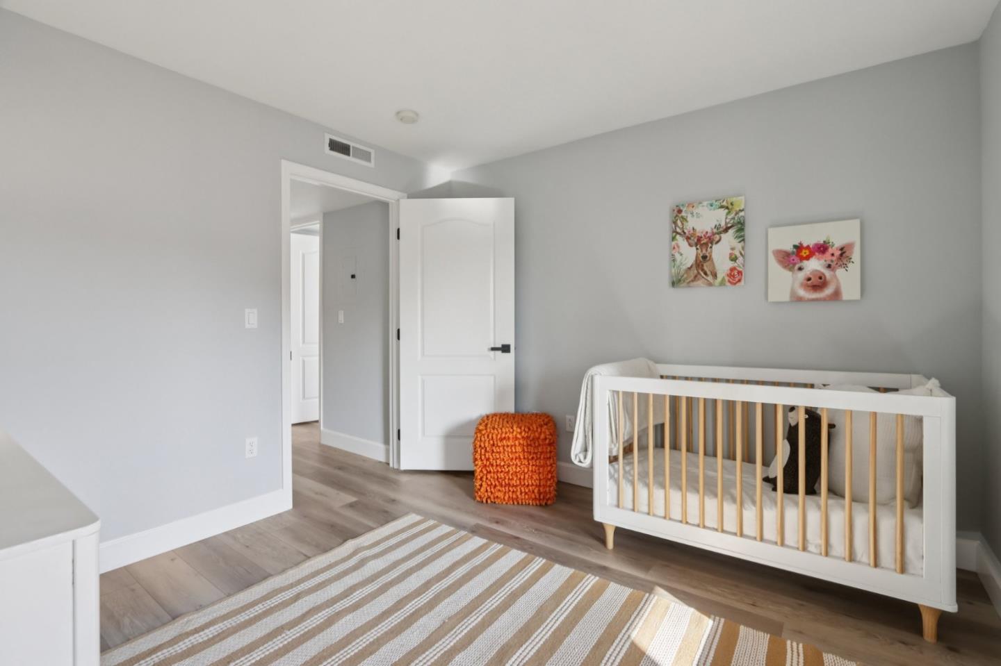1951 O'Farrell Street, Unit 404 San Mateo, CA 94403 - Photo 14 of 28 a bedroom with furniture and a window
