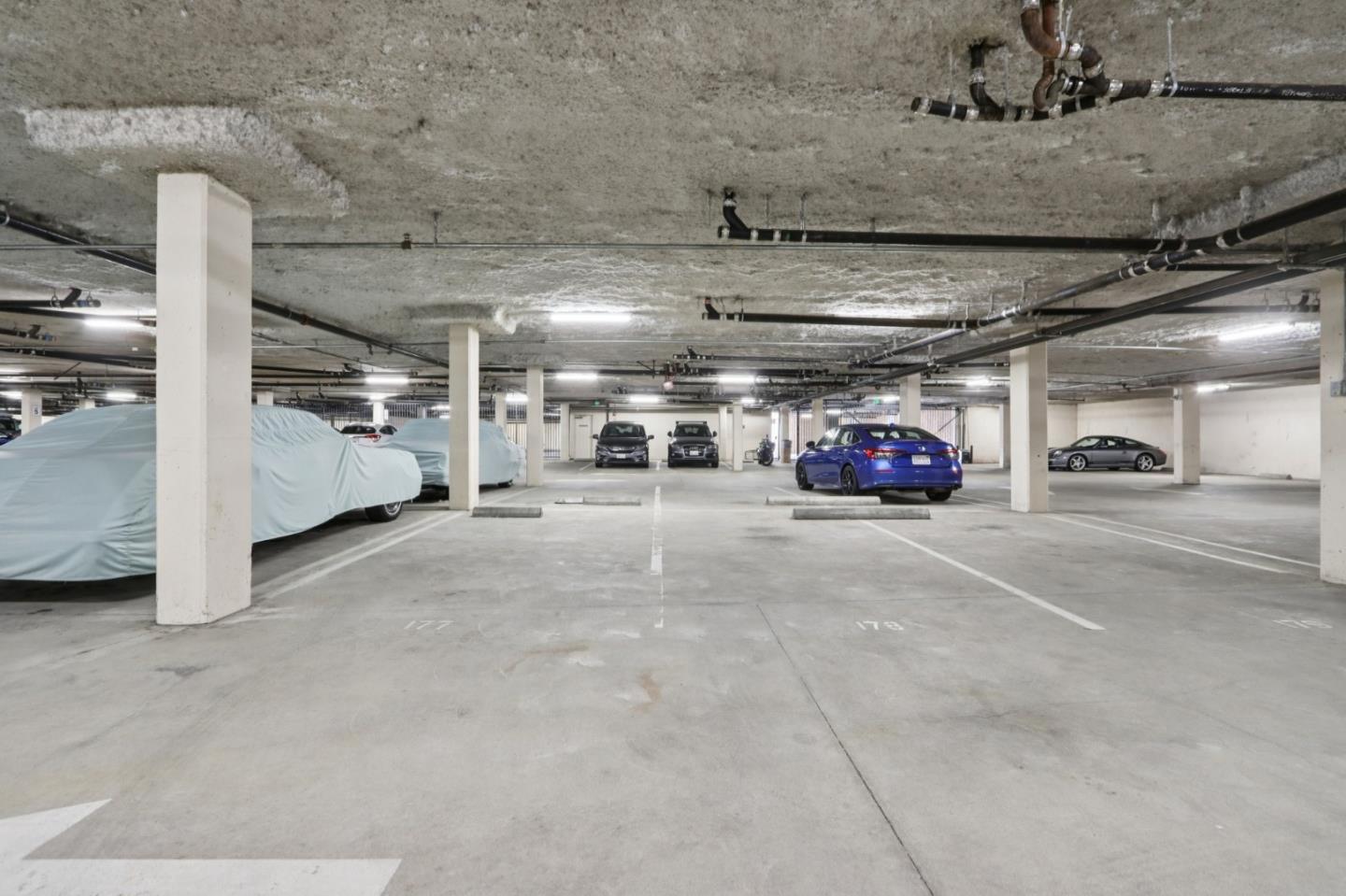 1951 O'Farrell Street, Unit 404 San Mateo, CA 94403 - Photo 26 of 28 a view of parking garage with cars
