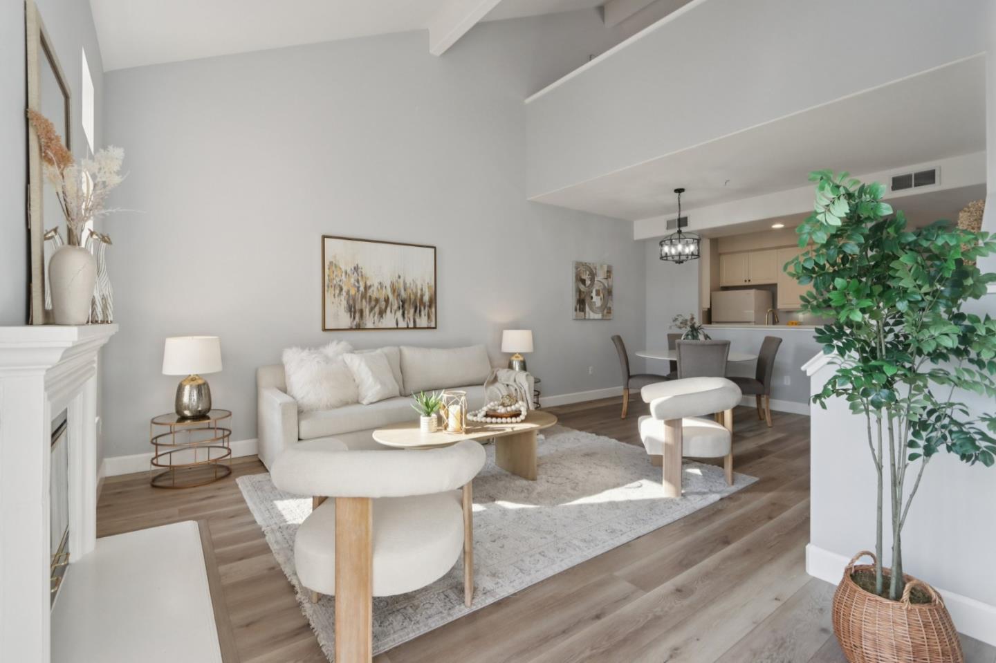 1951 O'Farrell Street, Unit 404 San Mateo, CA 94403 - Photo 5 of 28 a living room with furniture and a potted plant