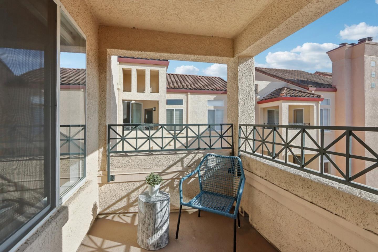 1951 O'Farrell Street, Unit 404 San Mateo, CA 94403 - Photo 7 of 28 a view of a chairs and table on the balcony
