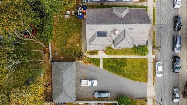 a aerial view of a house with a yard