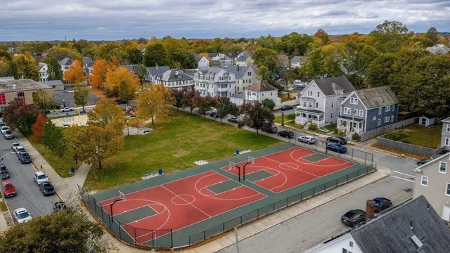 an aerial view of residential houses with outdoor space