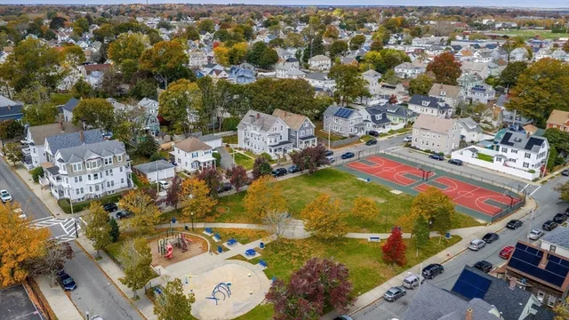 an aerial view of residential houses with outdoor space
