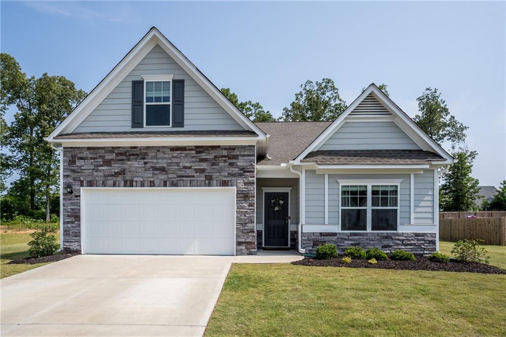 23 Sleepy Oaks Trail Rome, GA 30165 - Photo 1 of 1 a front view of a house with a yard and garage