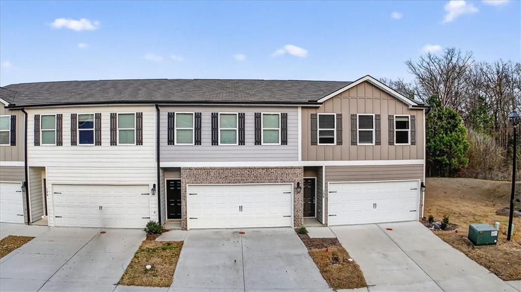 a front view of a house with a garage