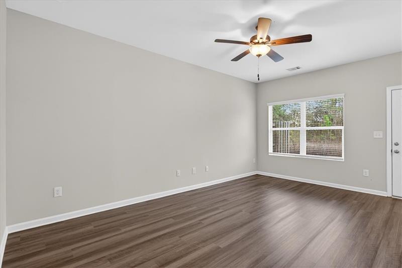 136 Brexley Drive Calhoun, GA 30701 - Photo 21 of 48 a view of an empty room with wooden floor and a window