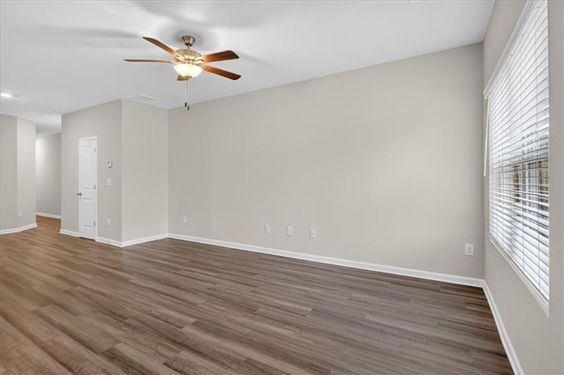 136 Brexley Drive Calhoun, GA 30701 - Photo 23 of 48 wooden floor in an empty room with a window