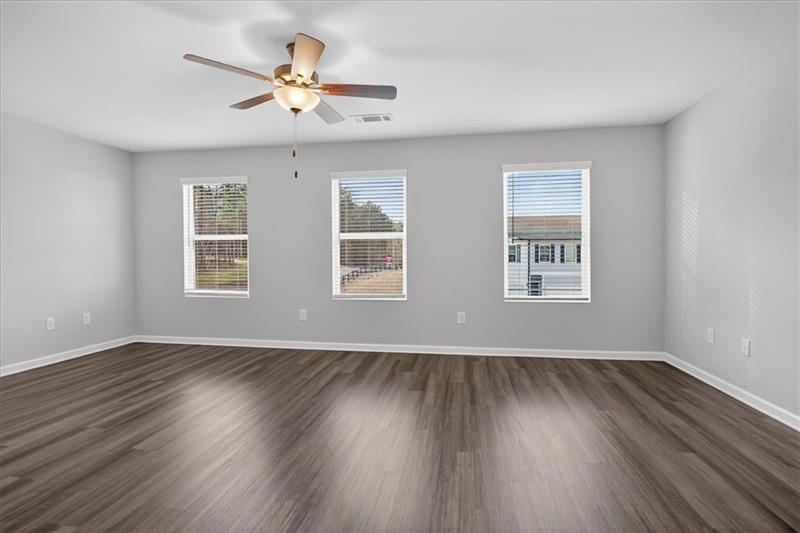 136 Brexley Drive Calhoun, GA 30701 - Photo 28 of 48 a view of an empty room with wooden floor and a window